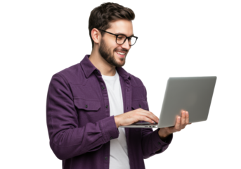 Young caucasian man, mid-20s, with dark hair, beard, black glasses, purple shacket over white t-shirt, smiling confidently, actively engaged with sleek grey laptop in a professional studio setting,