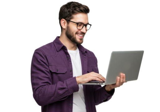 Young caucasian man, mid-20s, with dark hair, beard, black glasses, purple shacket over white t-shirt, smiling confidently, actively engaged with sleek grey laptop in a professional studio setting, - Powered by Adobe