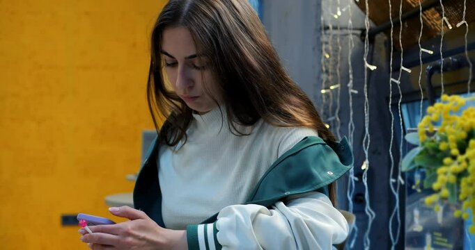 Woman scrolling smartphone at cafe table, smartphone glow repeated highlighting digital engagement, smartphone notifications creating dynamic modern lifestyle scene framed by cozy cafe ambiance