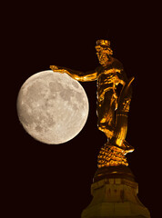 statue of the townhall in Dresden in front of the moon