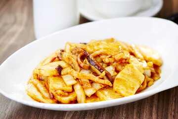 Stir fried Rice Cakes with XO Sauce served in plate side view of Asian Cuisine Delicacy