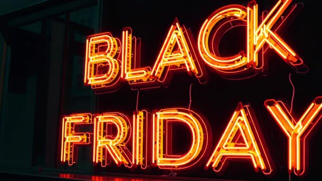 Bright orange neon "BLACK FRIDAY" sign glowing against a dark background, symbolizing retail sales, shopping events, and discount promotions.

