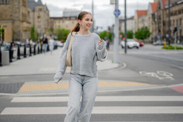 Pretty Girl On Crosswalk Crossing The Street