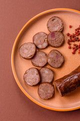 Homemade meat or vegan sausage grilled with spices. Homemade sausage cooked on barbecue