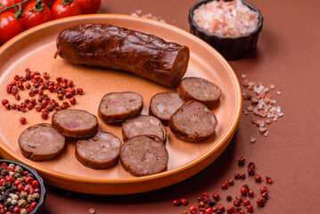 Homemade meat or vegan sausage grilled with spices. Homemade sausage cooked on barbecue