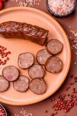 Homemade meat or vegan sausage grilled with spices. Homemade sausage cooked on barbecue