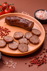 Homemade meat or vegan sausage grilled with spices. Homemade sausage cooked on barbecue
