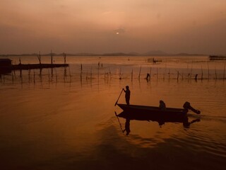 Golden Sunset on South China Sea fisherman return home with catch of the day