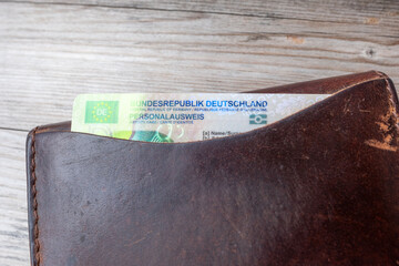 German ID card in brown leather wallet with EU flag, Modern European personal document, European...