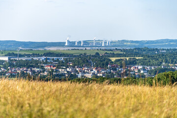 Hradek nad Nisou showcases a picturesque backdrop with the Turow Coal Mine visible in the distance....