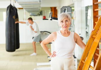 Portrait of mature woman in the gym for self defense exercises