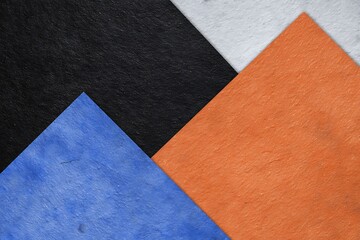 Fototapeta premium Overlapping colorful textured paper geometric shapes