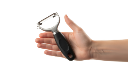 A hand holding a y shaped peeler with a black handle against a black and white background image