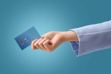 Hand with credit card on blue background