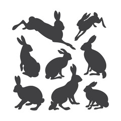 Set of black silhouettes of different breeds of hares. Sitting, running, jumping, standing animals on white background. Vector illustration.