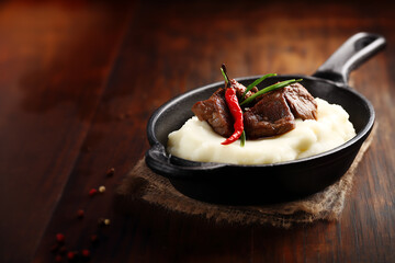 National Dishes of Hungary - Pörkölt - beef fried and then stewed with paprika and onions