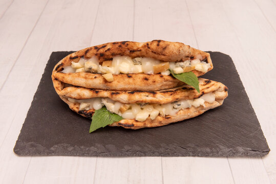 Typical of Campania, the panuozzo is a type of sandwich made with the same dough as Neapolitan pizza