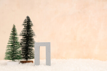 Decorative Christmas trees and snow with plaster podium on beige grunge background