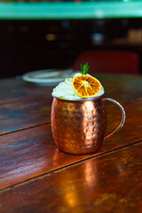 A beautifully garnished Moscow Mule cocktail in a copper mug, ready to enjoy on a warm night.