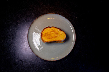 A golden, toasted sandwich sits appetizingly on a plate, offering a delicious meal for any time.