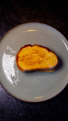 A delicious grilled cheese sandwich on a plate, ready for a tasty meal.