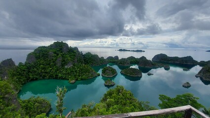 Blurry foreground with railing overlooking clustered islands