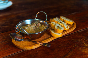 Delectable appetizer with toasted bread on a wooden serving board, ready to be enjoyed.