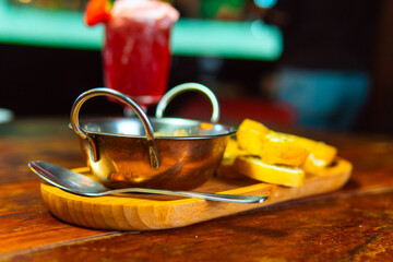 A delicious meal of soup and bread with a cocktail, ready to be enjoyed.
