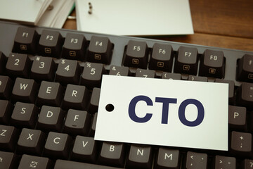 There is word card with the word CTO. It is an abbreviation for Chief Technology Officer as...