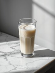 Creamy Coffee Drink in Glass on Marble Surface