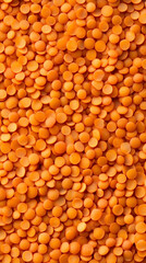 Close-up of orange lentils texture for culinary purposes or food photography with copy space