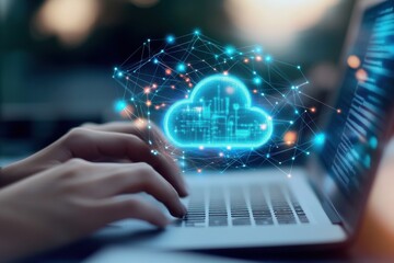 Hands typing on laptop with glowing cloud graphic overlay representing cloud computing concept