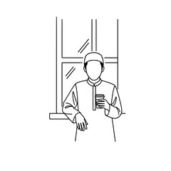 Person holding a drink by the window in a minimalistic setting