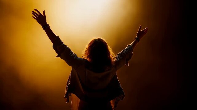 Female Christian worshipper with raised arms singing at youth festival concert back view 4K Seamless loop animation