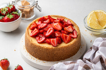 Classic cheesecake with strawberries on light background. New York, Sicilian homemade cheesecake....