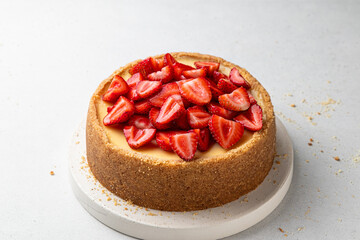 Classic cheesecake with strawberries on light background. New York, Sicilian homemade cheesecake....