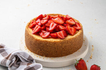 Classic cheesecake with strawberries on light background. New York, Sicilian homemade cheesecake....