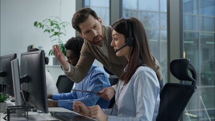 Multinational call center office conflict angry displeased Caucasian male supervisor scolds callcenter female operator African business man Indian woman working support headset tension stress problems