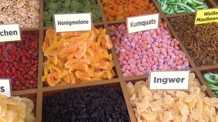 Assortment of colorful dried fruits on display at a market