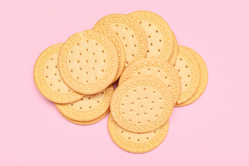 Many sweet cookies on pink background