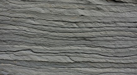 Striking gray slate texture with distinct horizontal layers, showcasing the geological formation