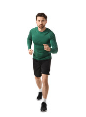 Sporty young man running marathon on white background