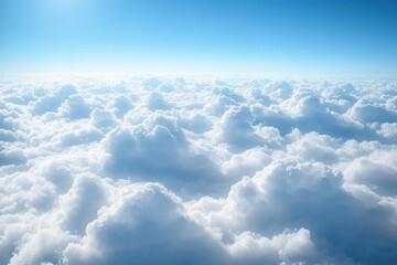 Expansive view of fluffy white clouds under bright blue sky conveying a sense of tranquility and vastness