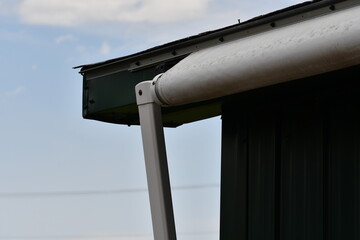 Awning on small wooden structure. Fully withdrawn.