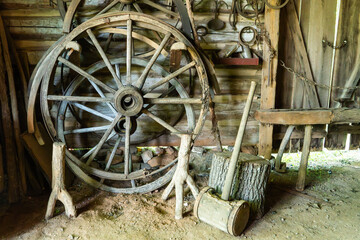 Wooden wagon wheel parts in a blacksmith's shop