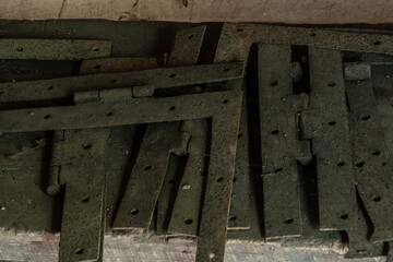 A stack of rusty iron brackets