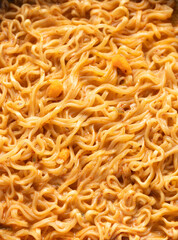 Top view of instant noodles in spicy soup for background