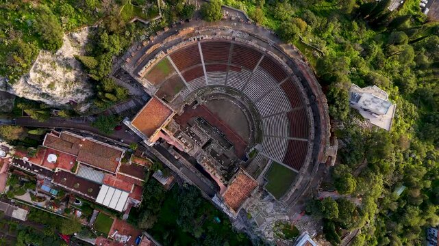 Aerial drone view of Teatro Antico di Taormina during sunrise, Sicily, italy