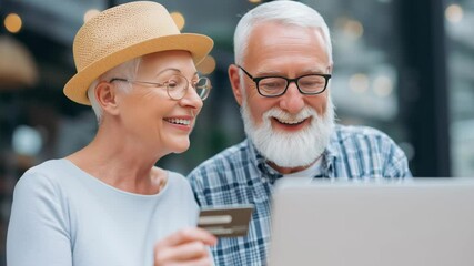 Social security benefits and shopping online concept, Cheerful seniors together with a credit card. - Powered by Adobe