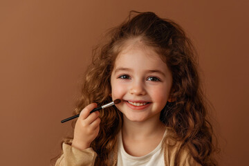 Joyful girl applying makeup with a brush in a warm-toned setting, showcasing creativity and self-expression